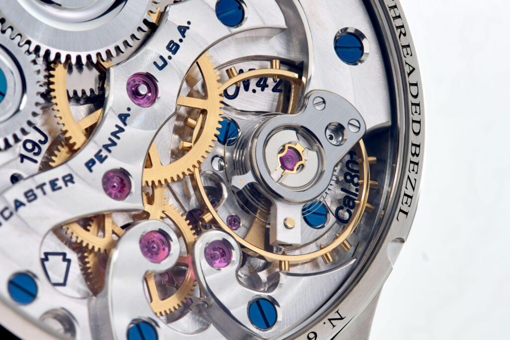The Caliber 801, RGM's in-house movement. The bridge shapes reference the Keystone Howard "Edward Howard," the winding click derives from an Illinois Watch Company patent of 1918, and the winding wheels are finished in the manner of the Illinois "Bunn Special."